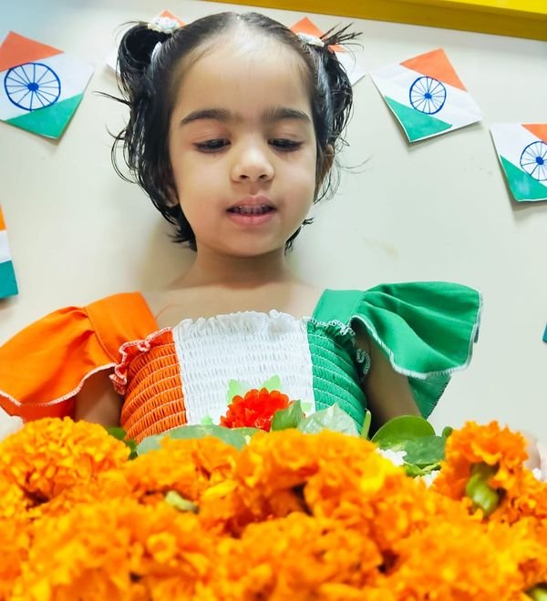 A child in a tricolour outfit for the Independence Day celebration